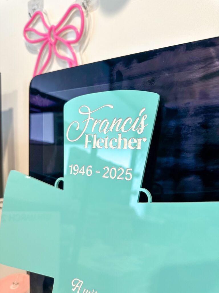 acrylic cross with a personal touch, a customised memorial plaque for a loved one.