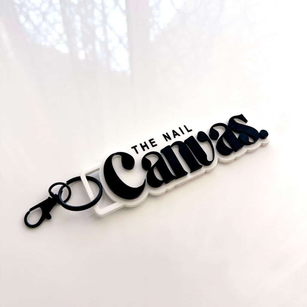 Custom logo business keychains made from layered acrylic. Personalised, handcrafted, and bespoke. for businesses to promote.