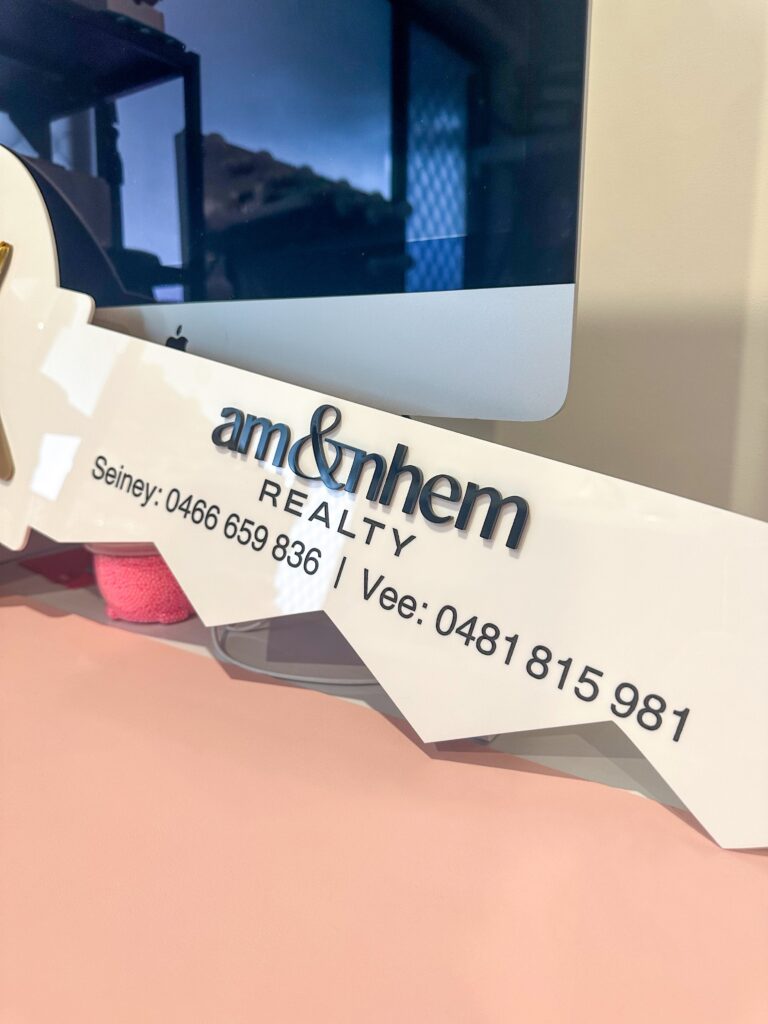 Personalised layered acrylic realtor key sign with logo for professional closing photos and client gifts.