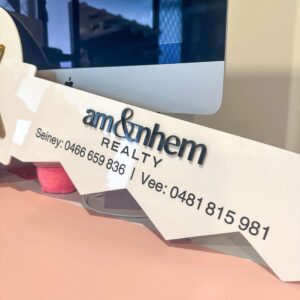Personalised layered acrylic realtor key sign with logo for professional closing photos and client gifts.