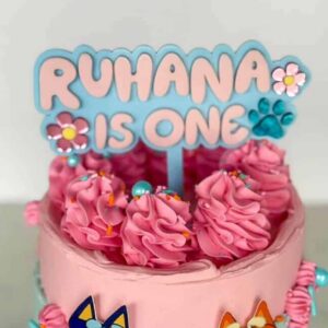 layered acrylic Bluey cake topper with mirrored finish, featuring Daisy and paw prints, ready for personalisation.