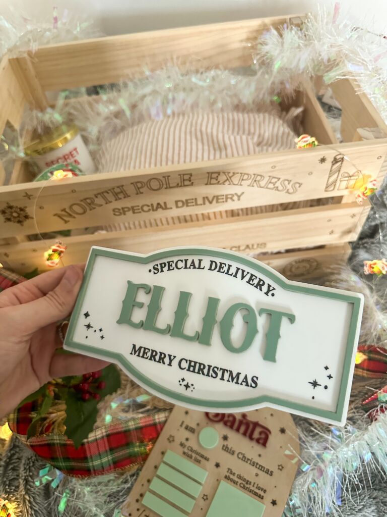 A custom Santa 3D engraved Christmas plaque made from layered acrylic, featuring a glossy finish.