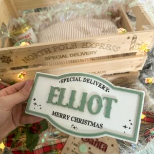A custom Santa 3D engraved Christmas plaque made from layered acrylic, featuring a glossy finish.