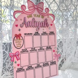 acrylic photo board with bow theme, personalised with a baby's name and birth details.