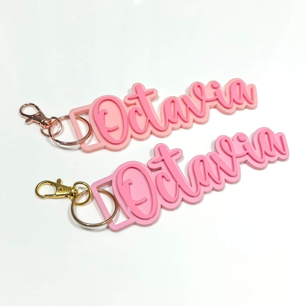 Custom double layer keychain and bag tag made from layered acrylic with a gold finish. Personalised, custom, handcrafted.