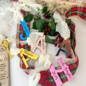 Acrylic letter ornaments with personalised engraved tags, available in various colours and finishes.