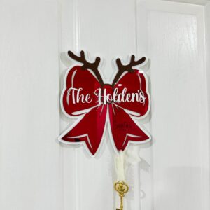Personalised Christmas bow door hanger made from layered acrylic with a mirrored finish, ready for personalisation.