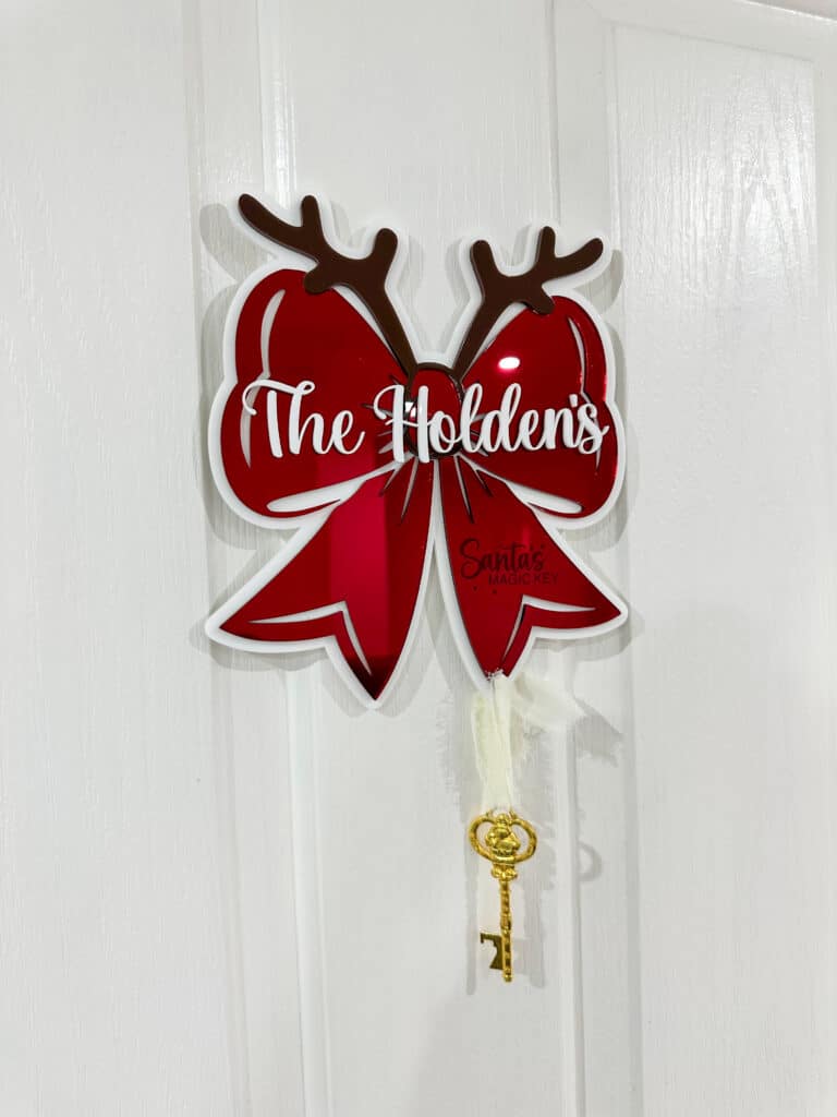 Personalised Santa's Key, a custom, handcrafted, layered acrylic door hanger with a mirrored finish.