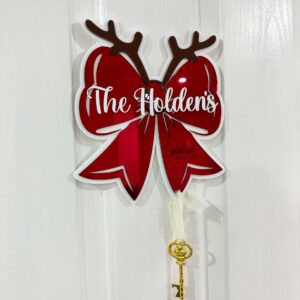 Personalised Santa's Key, a custom, handcrafted, layered acrylic door hanger with a mirrored finish.