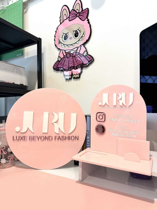 Personalised acrylic name sign featuring custom name lettering.