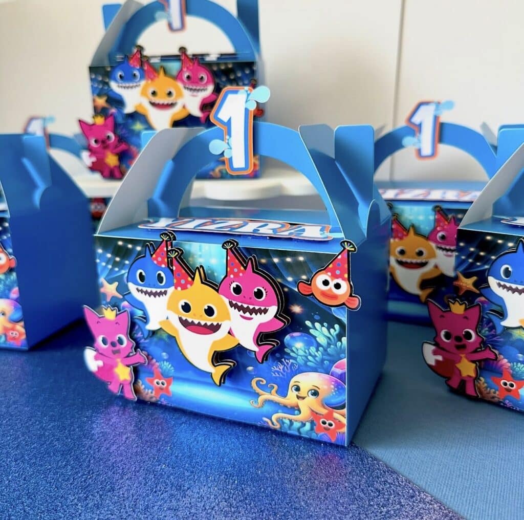 Custom party favour boxes personalised with sleek 2D prints or bold 3D layered acrylic designs for any theme.