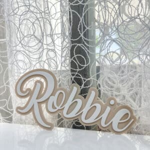 Personalised acrylic name sign photographed against a plain background.