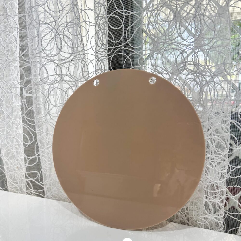 Personalised acrylic name sign on a neutral background.