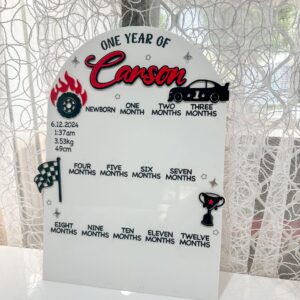 Personalised clear acrylic name sign with laser‑engraved lettering for wall display