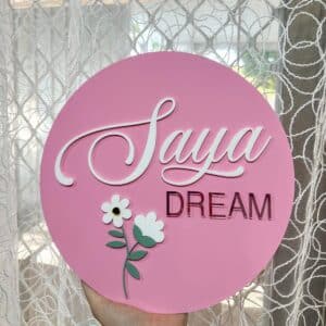 Personalised acrylic name sign for wall or shelf display.