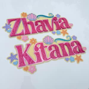 Personalised acrylic name sign in clear acrylic with script lettering on a neutral background.