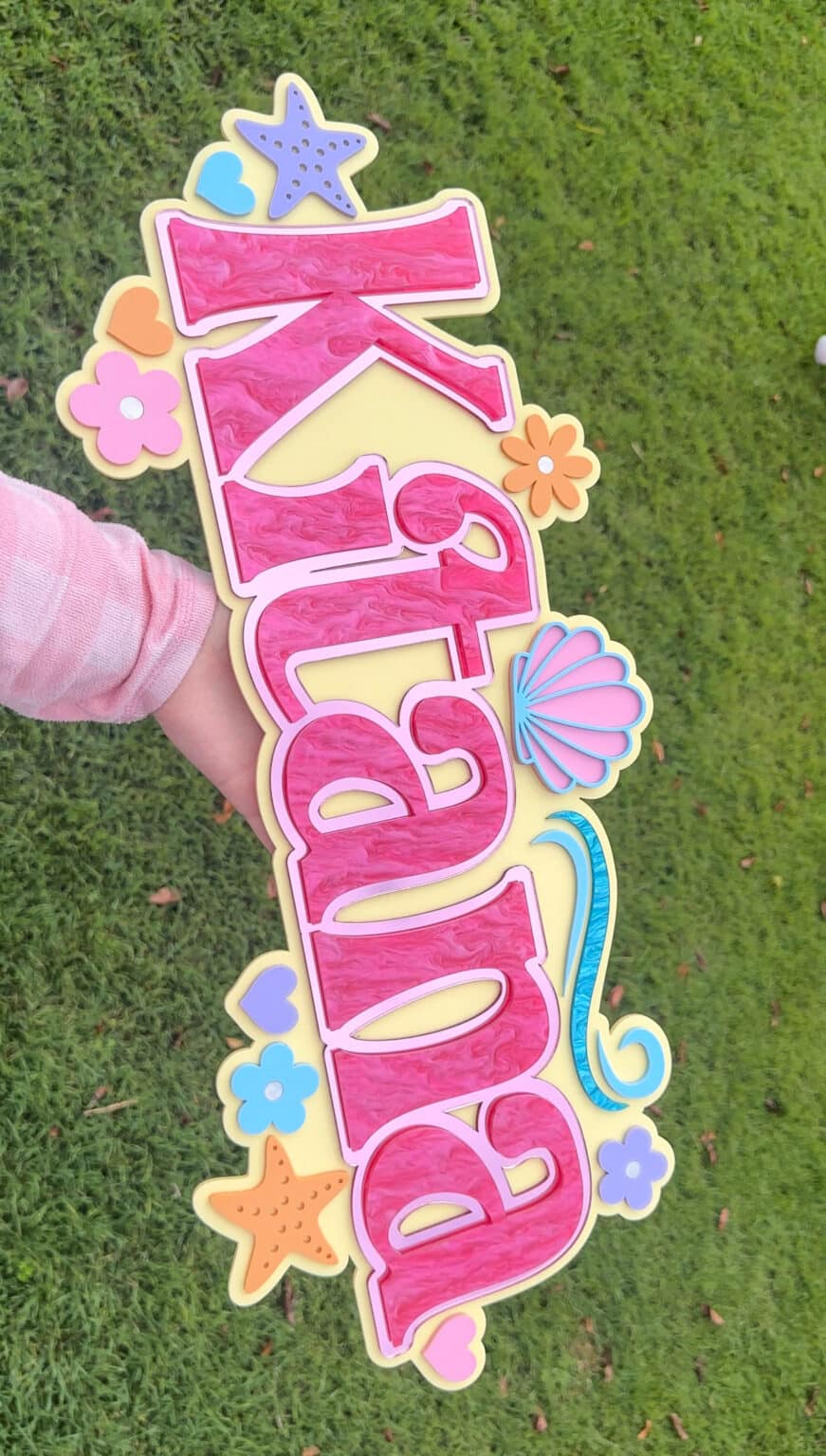 Custom theme triple layer name sign, personalised in script style, made of layered acrylic.