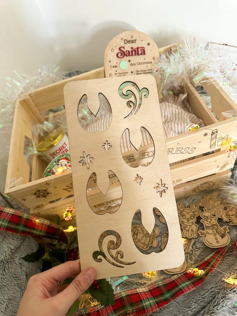 engraved wood name sign with a Santa Claus, Elf &amp; Reindeer design, ready for personalisation.