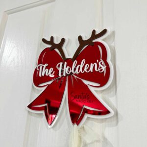 Personalised Christmas Bow Door Hanger – Santa’s Key, made from layered acrylic with a mirrored finish.