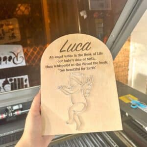 Personalised acrylic desk name plaque with laser-engraved lettering.