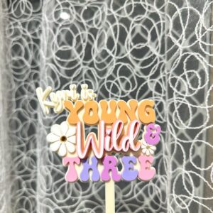 Personalised acrylic name sign in script style photographed on a plain background.