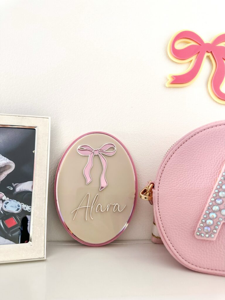 Personalised layered acrylic name sign with laser-engraved lettering, ready for personalisation.