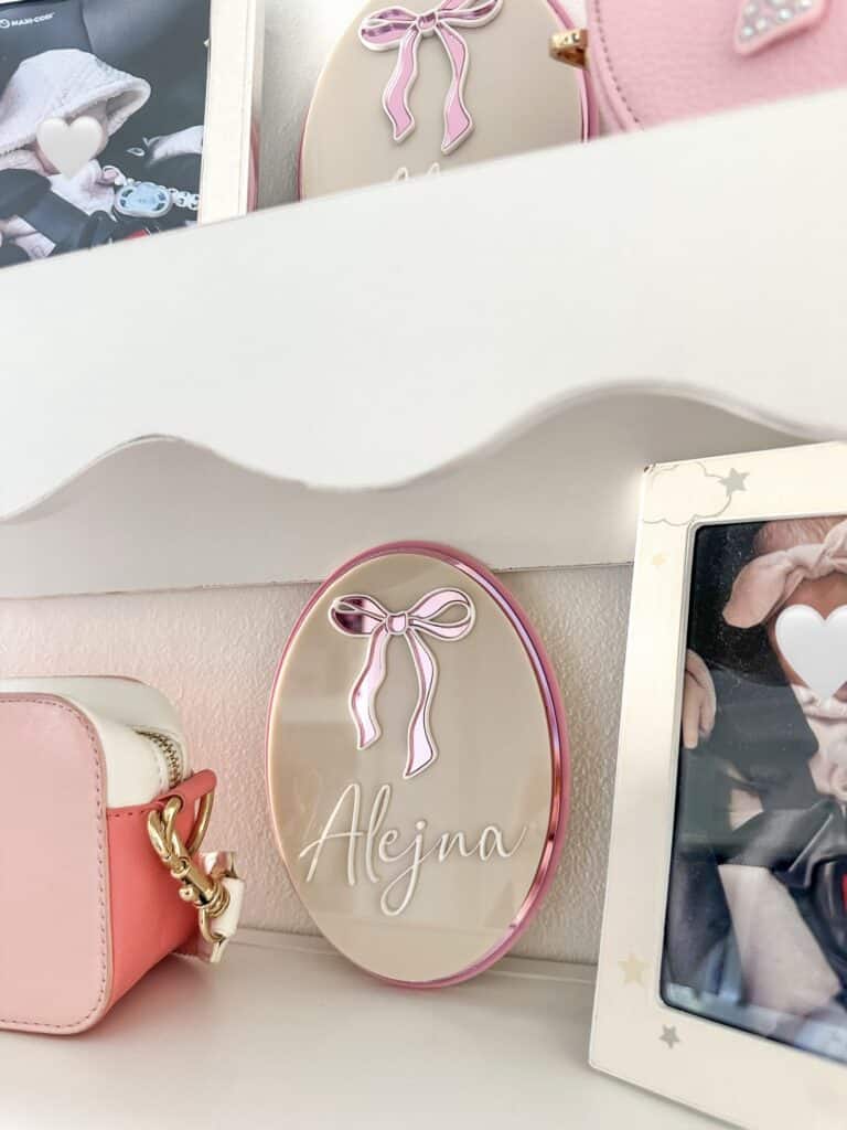 A custom, triple-layered acrylic name plaque featuring a hot air balloon design, ready for personalisation.