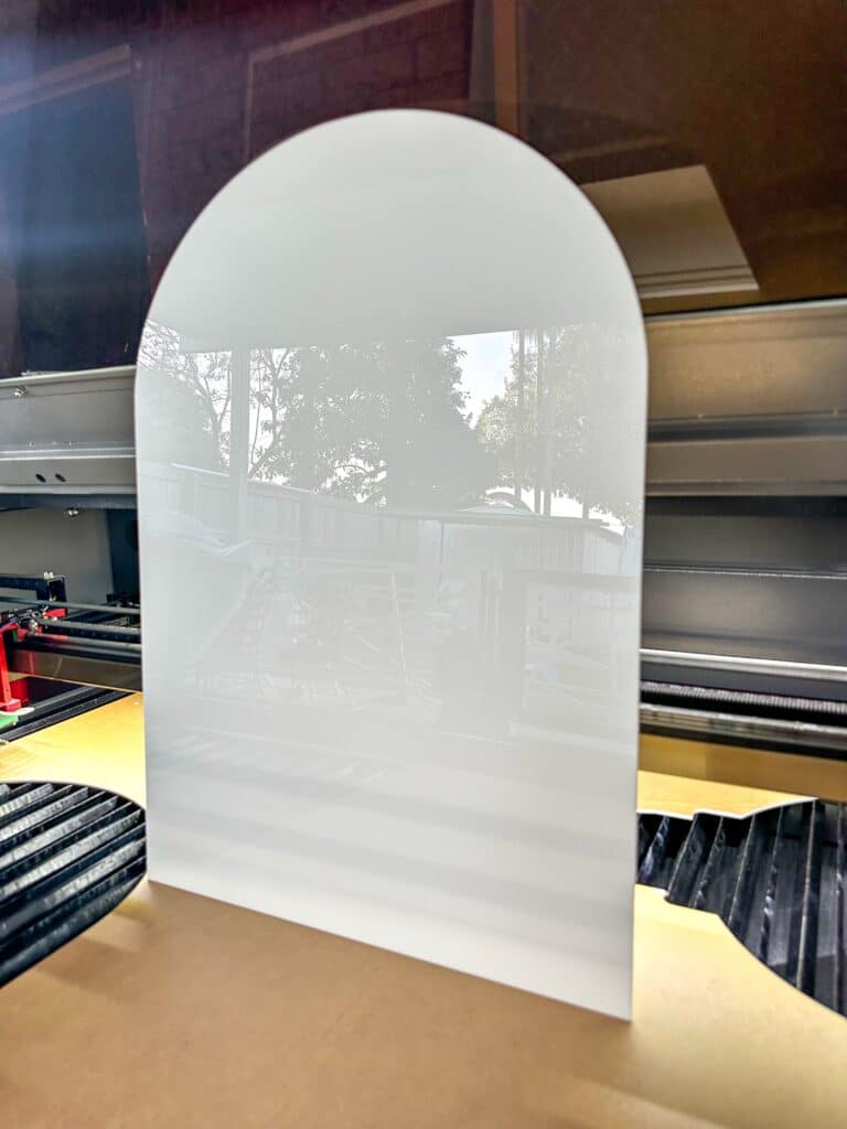 A custom, blank, arch-shaped acrylic plaque, available in various sizes from A6 to A1, for creating your own unique signs.