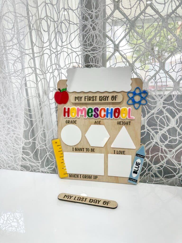 Vertical personalised acrylic name sign photographed on a neutral background.