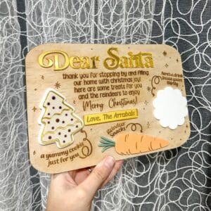 Christmas personalised acrylic name sign on a neutral background for product display.
