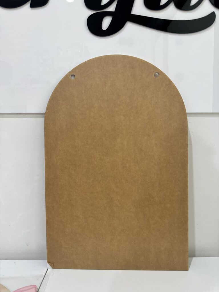 A custom, blank, arch-shaped, A6 to A1 size, acrylic plaque, ready for personalisation.