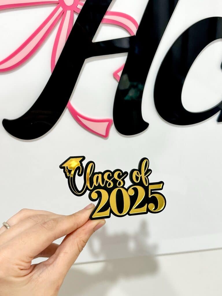 Acrylic cake topper charm, personalised with a double layer design. Customised with a unique touch, for special occasions.