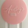 acrylic door sign for kids rooms and nursery, personalised with a custom name in a bold font.