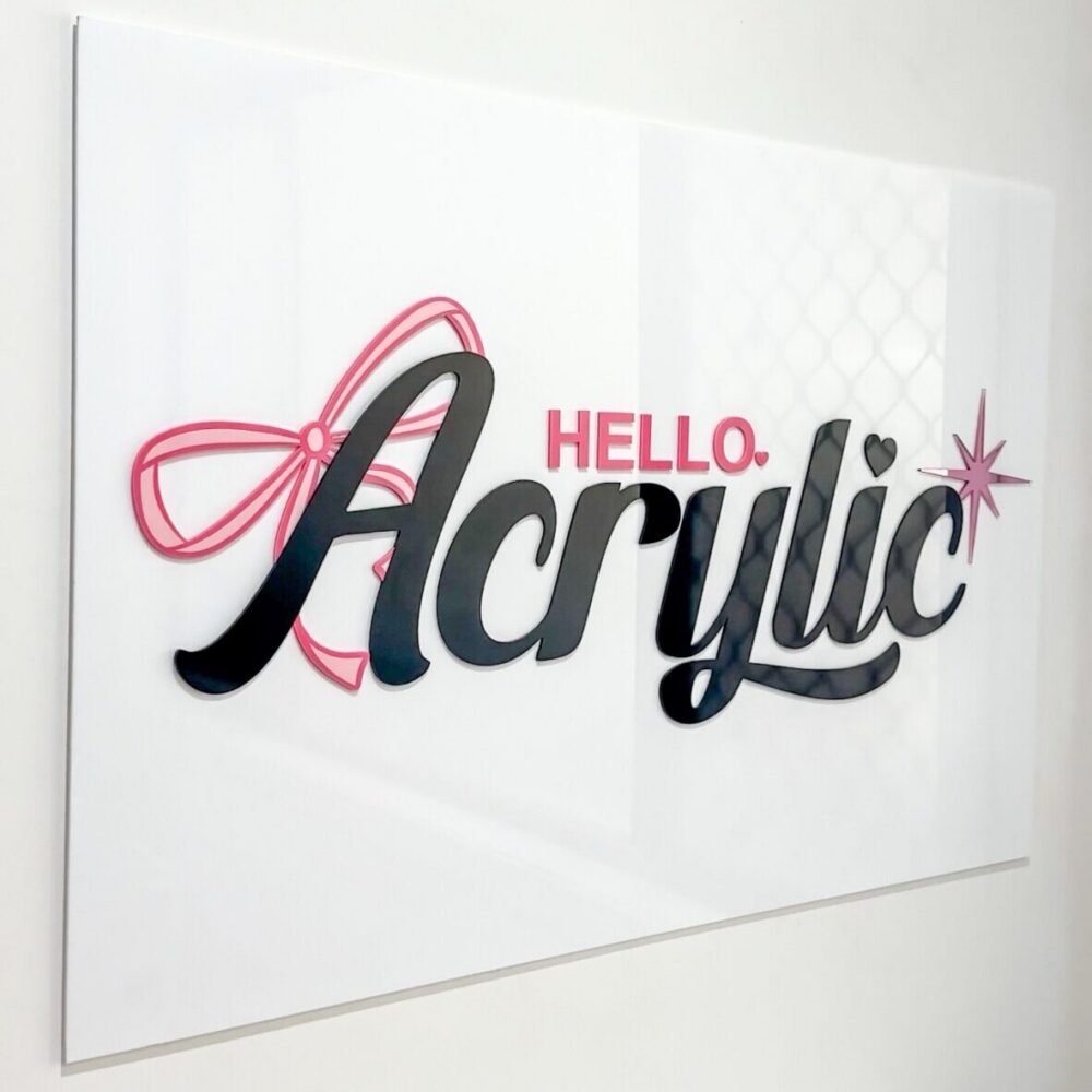 Personalised clear acrylic name sign on a neutral background.