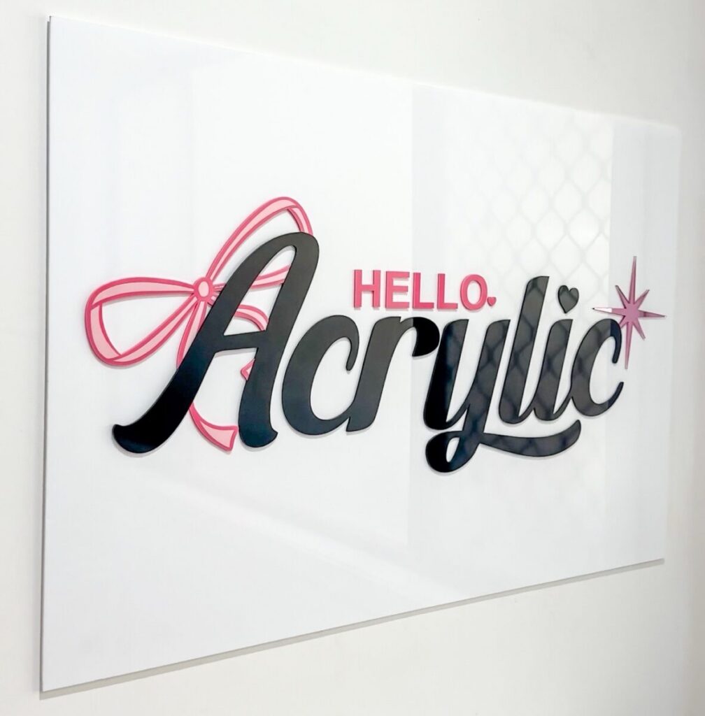 Personalised clear acrylic name sign on a neutral background.