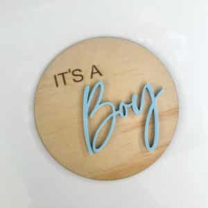 Clear personalised acrylic name plaque on a neutral background.