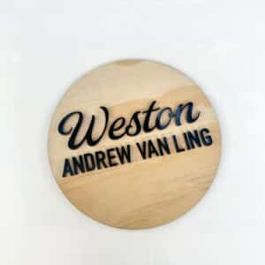 Personalised acrylic sign photographed on a neutral background.