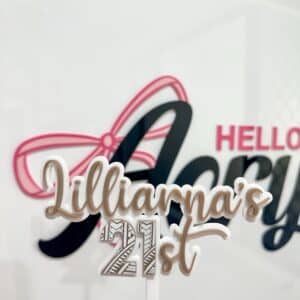 Personalised acrylic name sign showing custom lettering suitable for a nursery or desk.