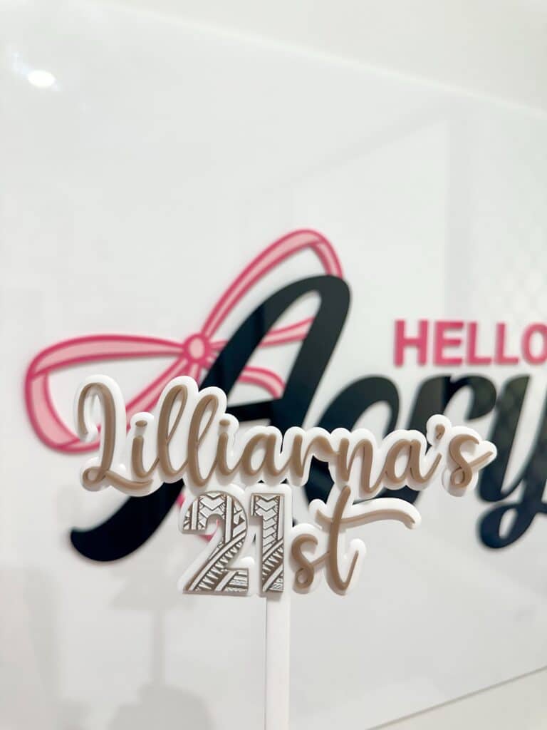 Personalised acrylic name sign showing custom lettering suitable for a nursery or desk.