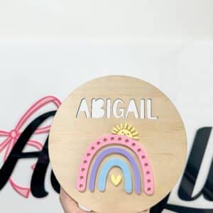 Personalised acrylic name sign photographed on a neutral background.