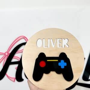 Personalised acrylic name sign on a plain background.