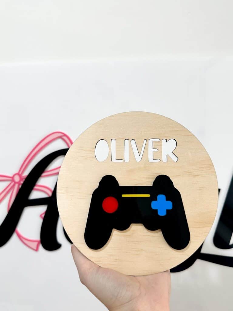 Personalised acrylic name sign on a plain background.