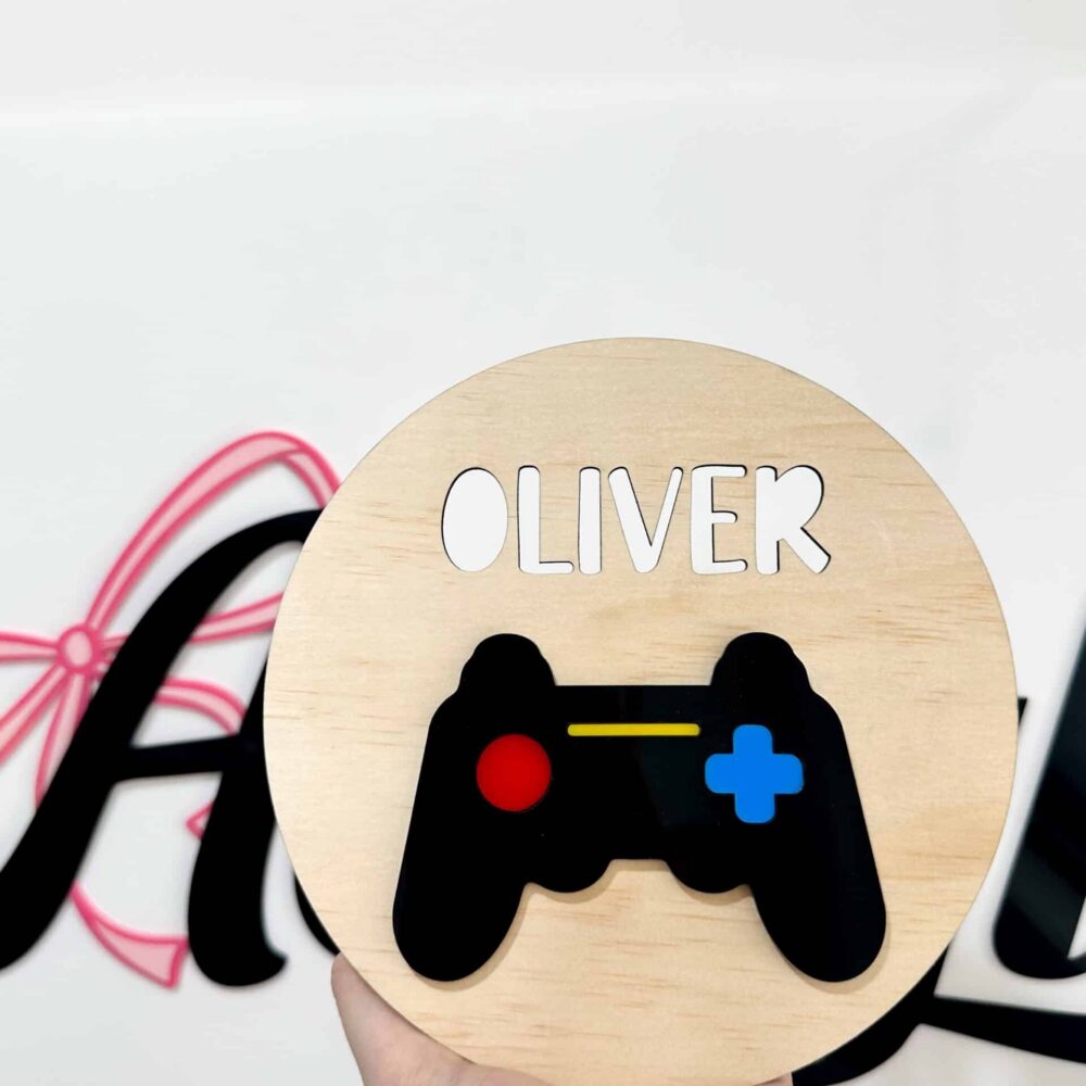 Personalised acrylic name sign on a plain background.