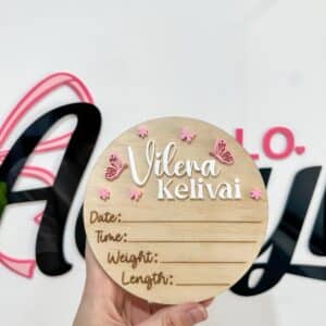 A personalised acrylic name sign with script lettering.