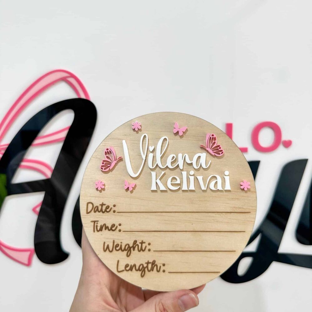 A personalised acrylic name sign with script lettering.