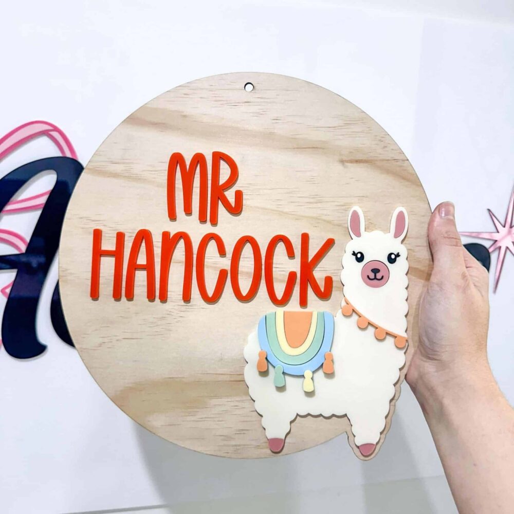 Personalised acrylic name plaque showing customised text on a clear panel