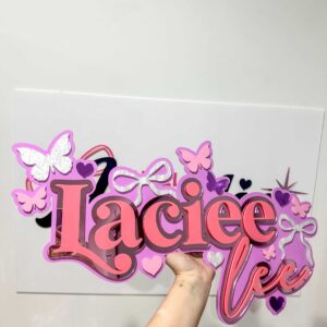 Personalised acrylic name wall sign on a plain background