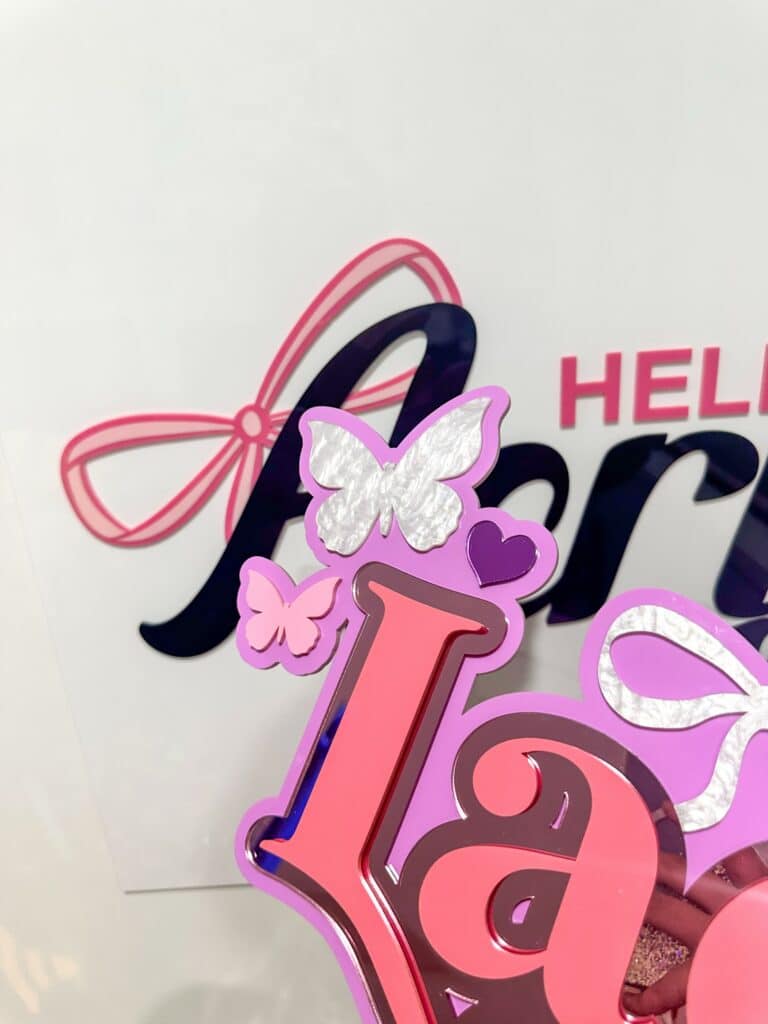 Clear personalised acrylic desk plaque with laser‑engraved name.