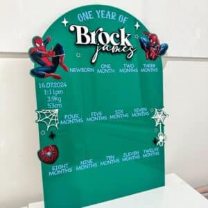 Personalised clear acrylic name sign on a neutral background.