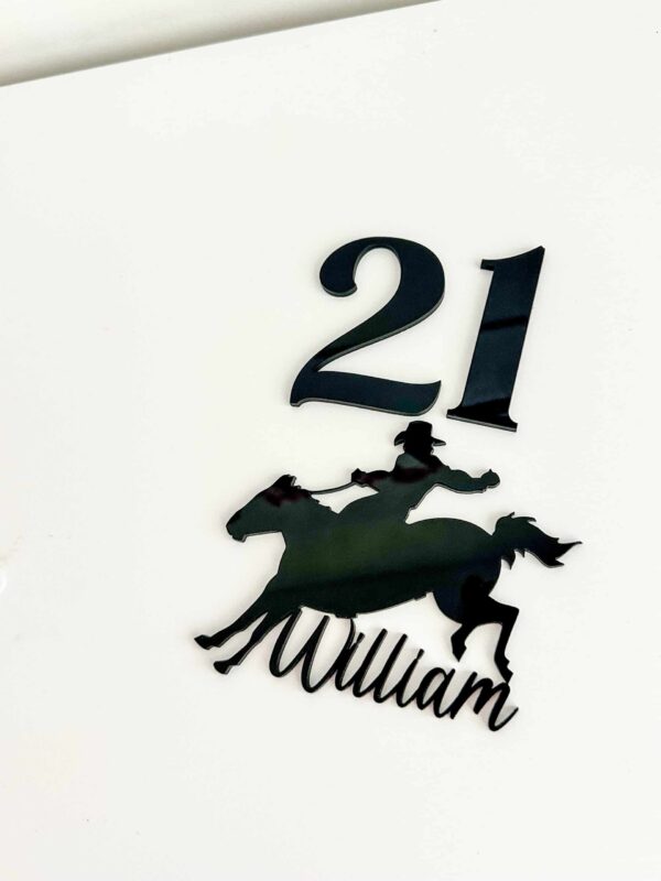 Personalised Acrylic Name Sign Script Personalised acrylic name sign in script lettering on a neutral background.